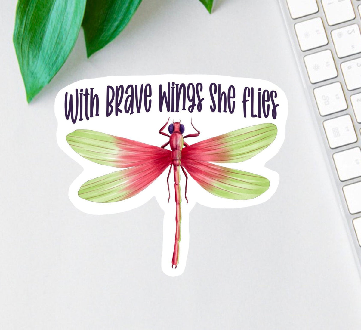 With Brave Wings She Flies sticker, warrior quote