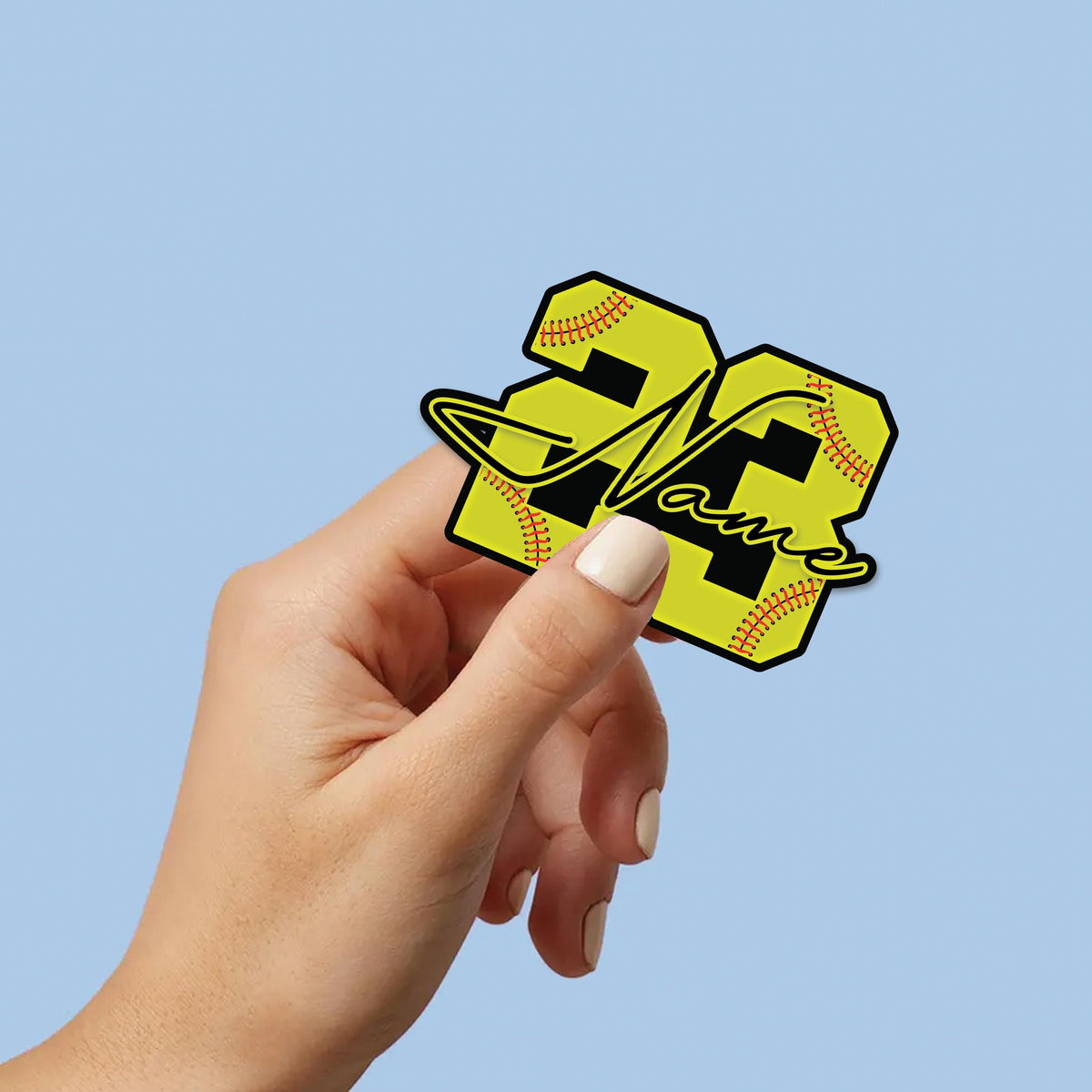 Custom softball sticker with a yellow stitched number and a script name – view 5