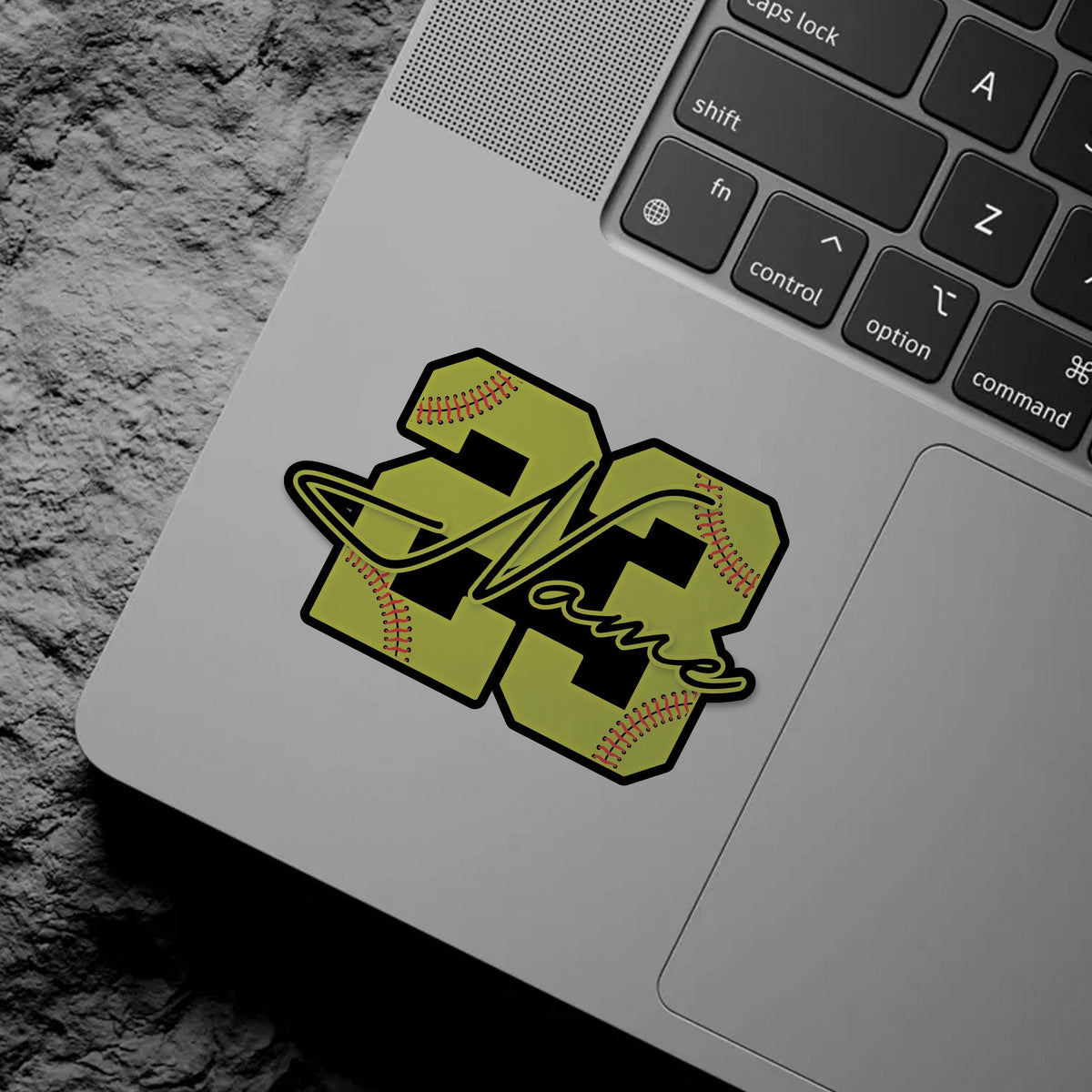 Custom softball sticker with a yellow stitched number and a script name – view 6