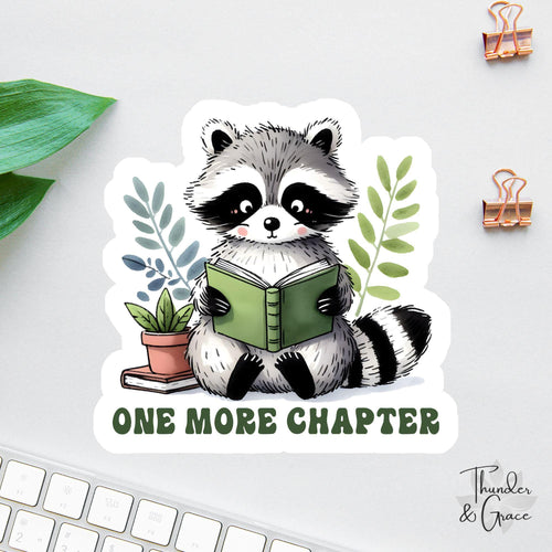 One More Chapter sticker, cute raccoon reading
